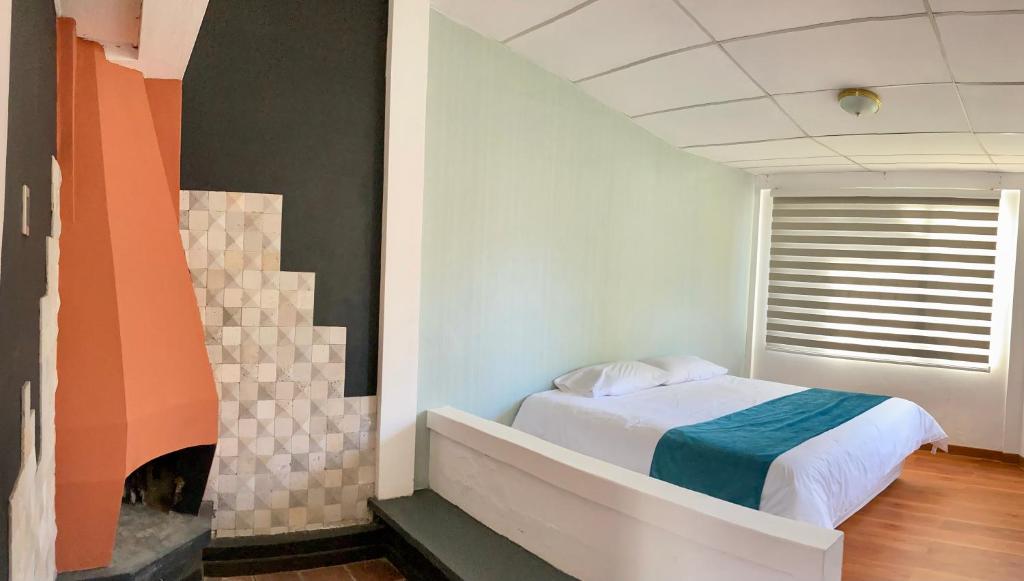 Postel nebo postele na pokoji v ubytování Hostería El Troje Experience