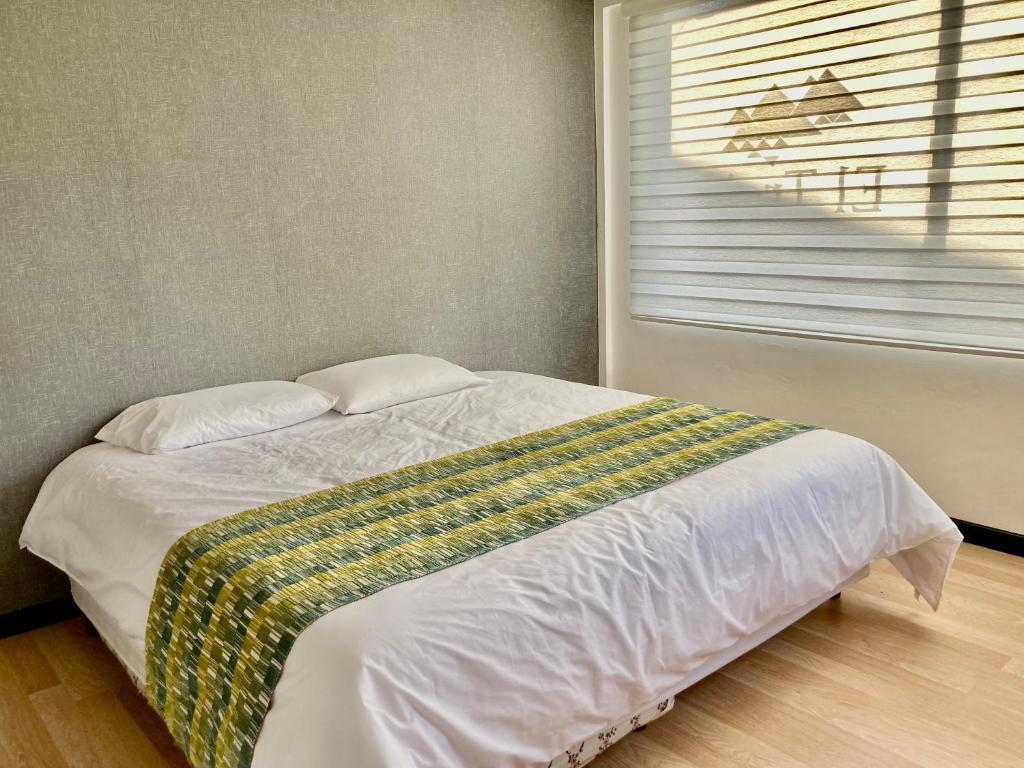 Postel nebo postele na pokoji v ubytování Hostería El Troje Experience