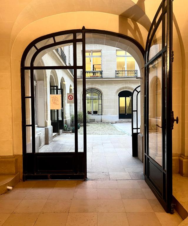 an entrance to a building with an open door at [New] Eiffel tower view studio &#47; Paris Étoile in Paris