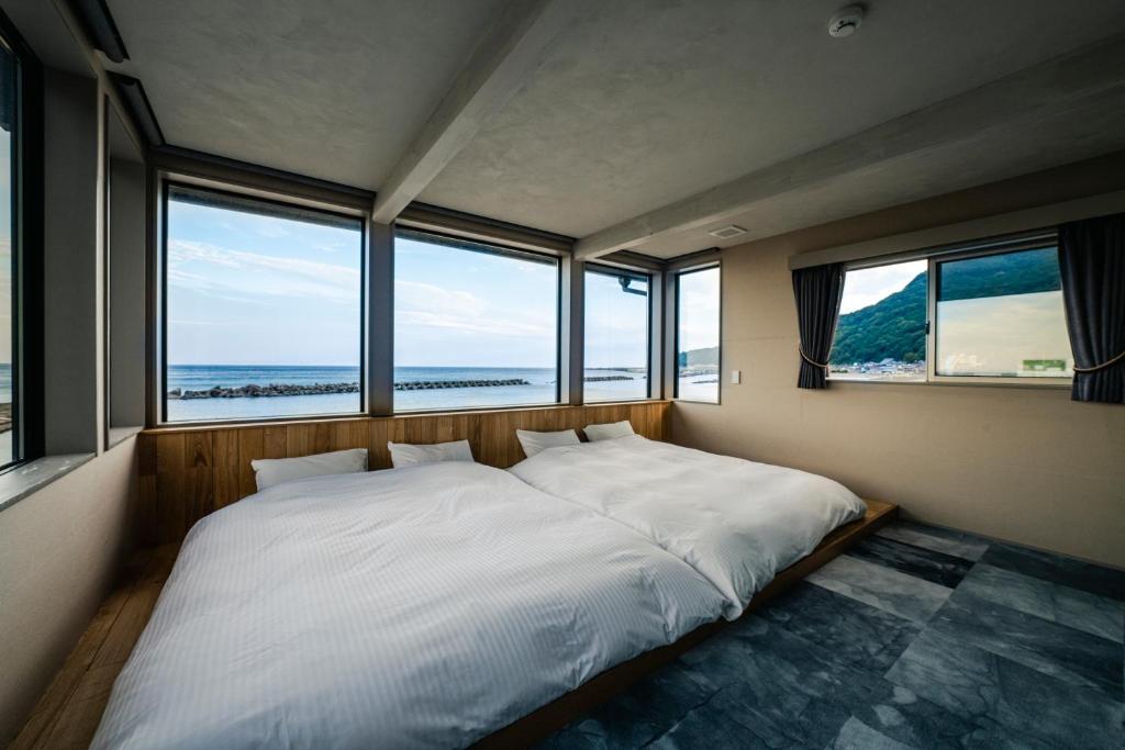 Postel nebo postele na pokoji v ubytování UMITOMA OCEANVIEW RESORT ECHIZEN