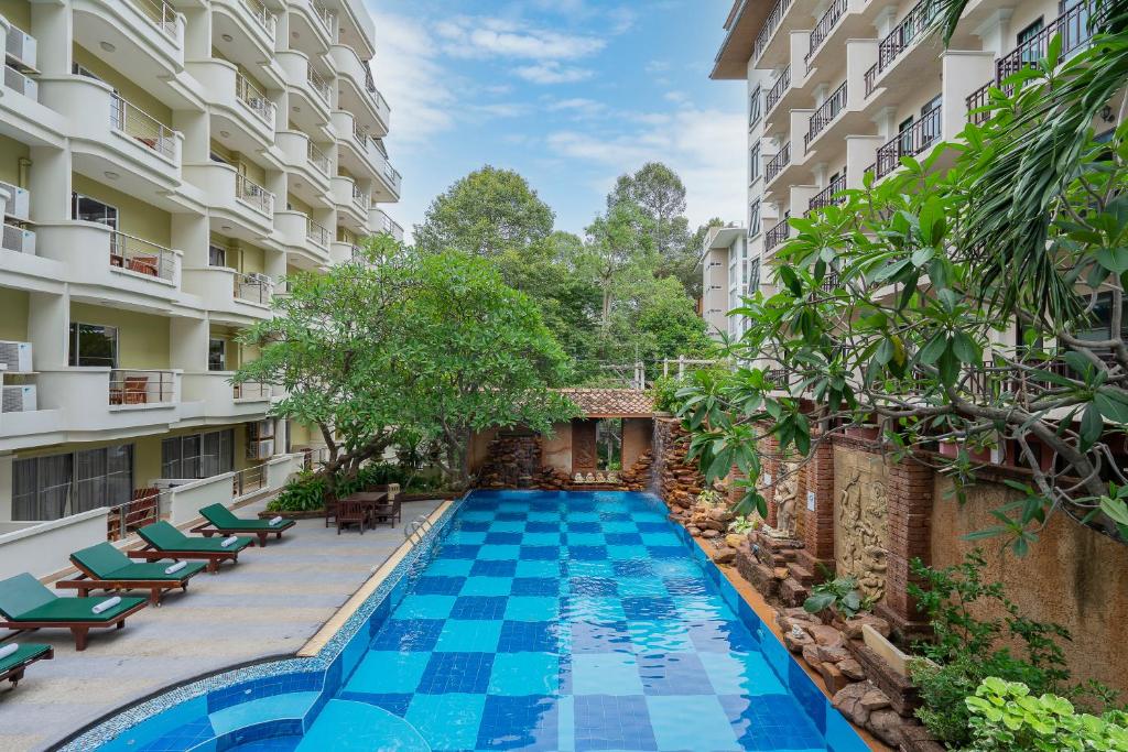 a swimming pool in the middle of a building at Bella Villa Prima in Pattaya Central