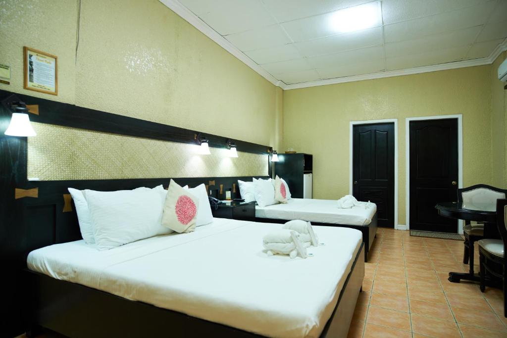 Postel nebo postele na pokoji v ubytování Dao Diamond Hotel & Restaurant