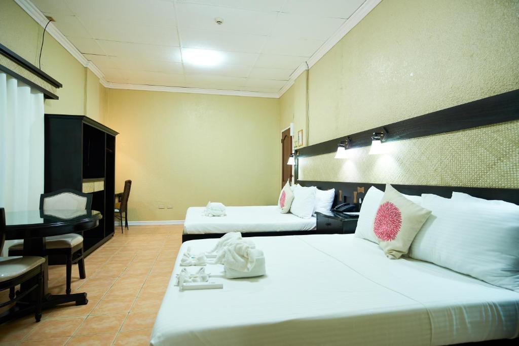 Postel nebo postele na pokoji v ubytování Dao Diamond Hotel & Restaurant