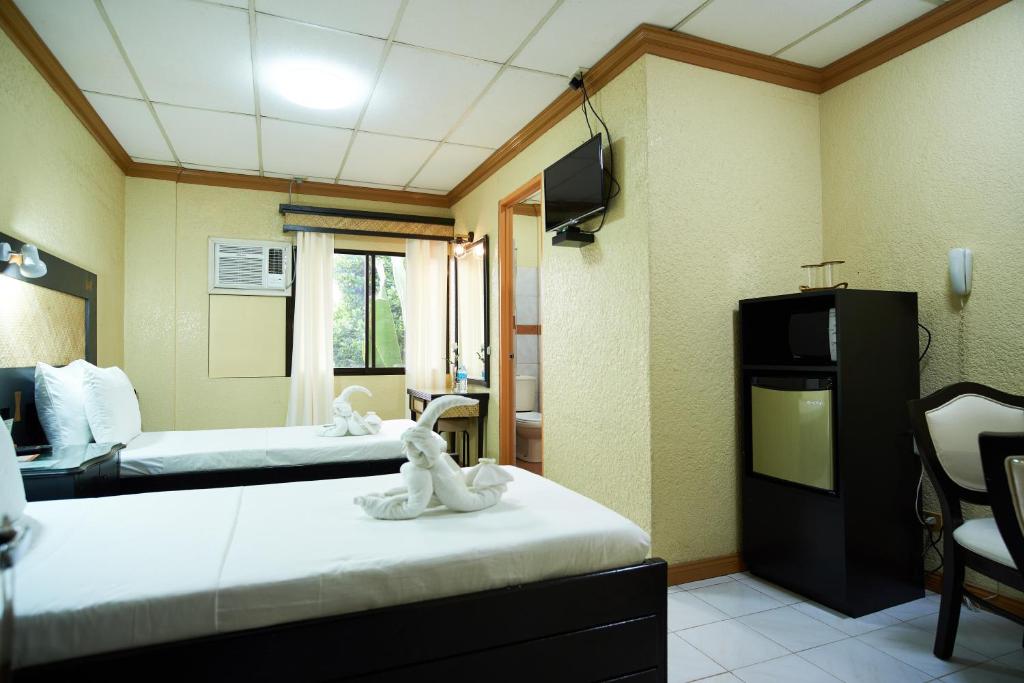 Postel nebo postele na pokoji v ubytování Dao Diamond Hotel & Restaurant
