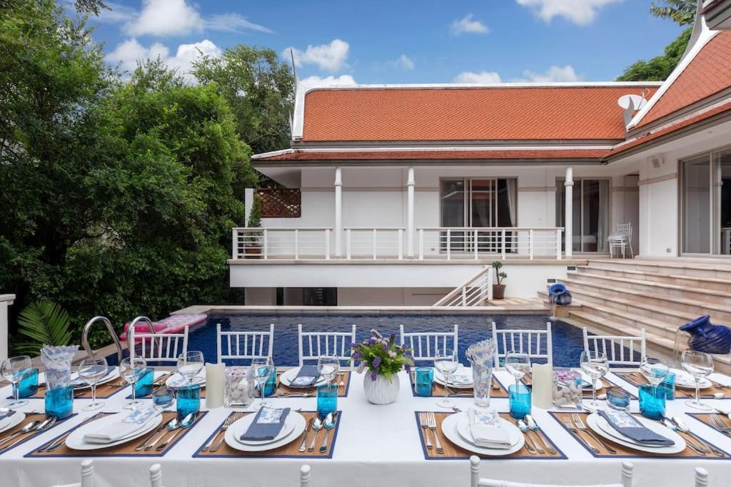 a table with blue and white dishes on it at Katamanda 3 Bed Tropical Villa B3 Near Kata Beach in Kata Beach