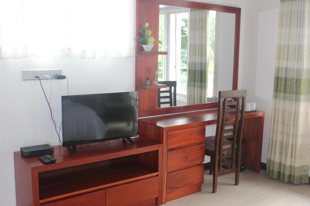 TV a/nebo společenská místnost v ubytování Cogent Holiday Home