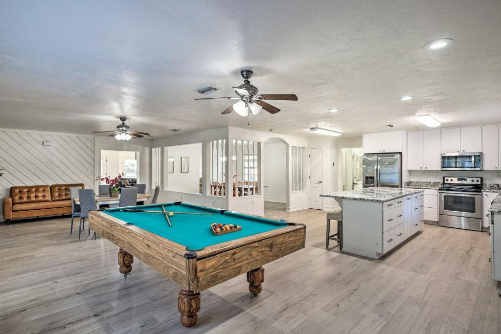 a living room with a pool table in it at Spacious Family Home w/ Backyard in Gainesville! in Gainesville
