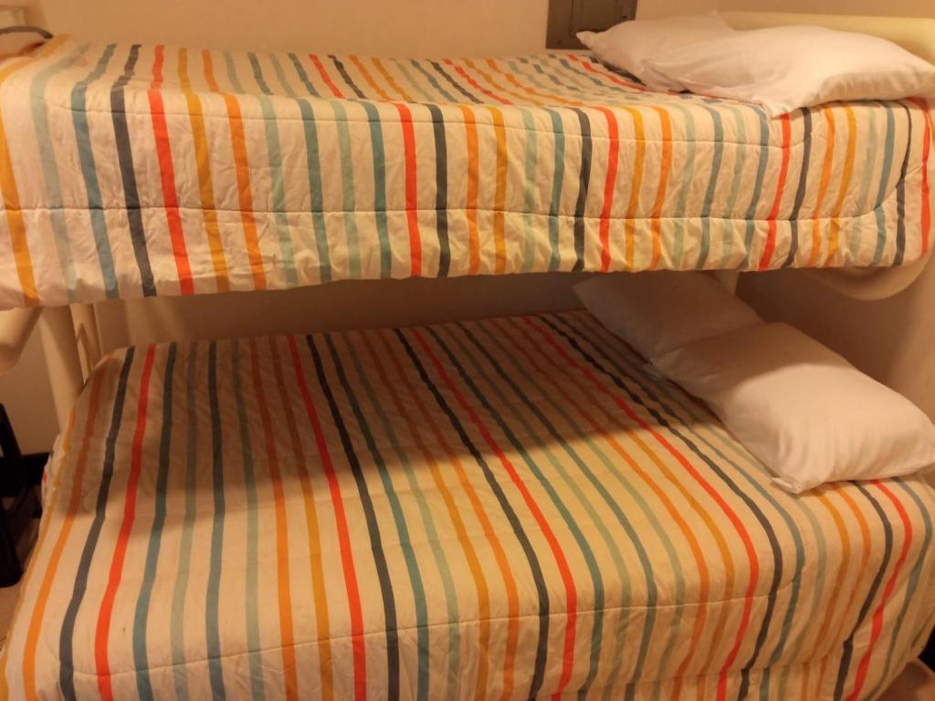 Кровать или кровати в номере Departamento con piscina frente al mar en Manta