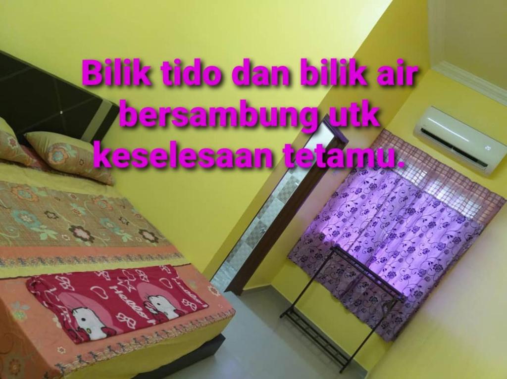 Postel nebo postele na pokoji v ubytování Teratak Nipah Homestay Teluk Nipah Pangkor