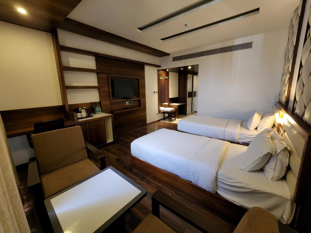 Postel nebo postele na pokoji v ubytování Hotel Preethi International
