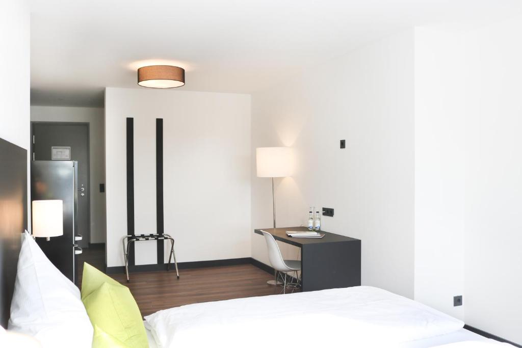 Postel nebo postele na pokoji v ubytování ING Hotel by WMM Hotels
