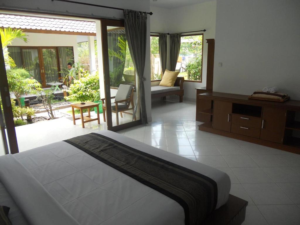 Ένα ή περισσότερα κρεβάτια σε δωμάτιο στο Gili Smile Bungalow