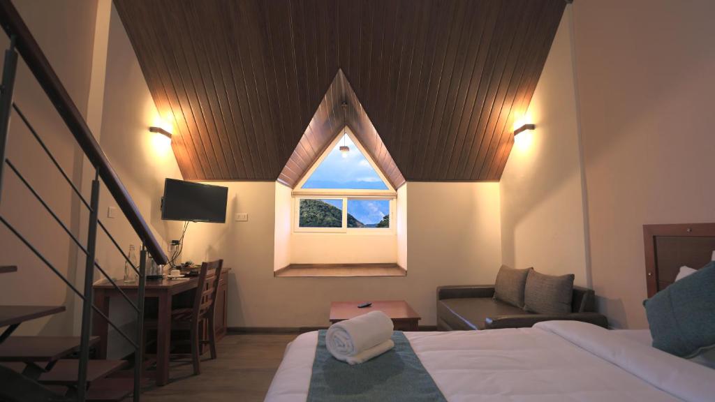 Postel nebo postele na pokoji v ubytování Shola Crown Resort - Munnar