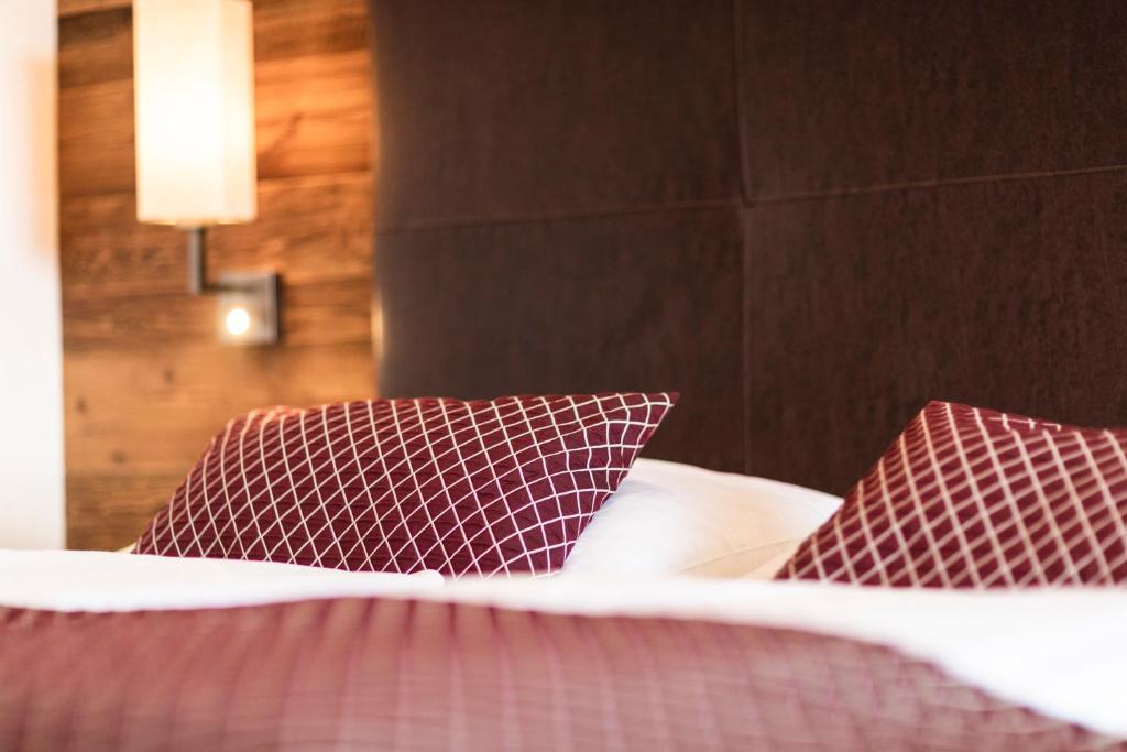 Postel nebo postele na pokoji v ubytování Hotel Der Heinrichshof