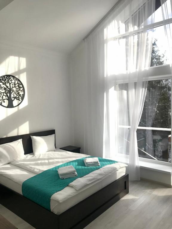 Postel nebo postele na pokoji v ubytování DACHA на Магурі