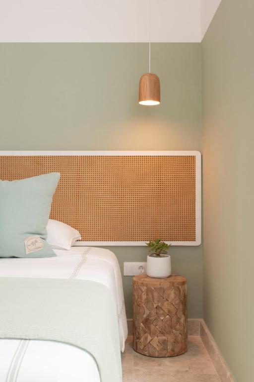 A bed or beds in a room at The Moss - Luxury Villa in Corralejo near the Beach