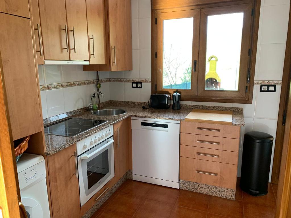 A kitchen or kitchenette at "CHALET A ESTRENAR" MIRADOR DE LA VENTOSA-Potes