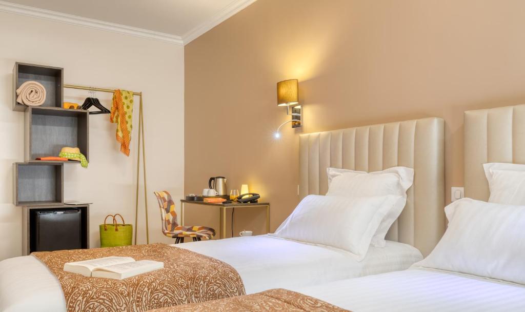 Posteľ alebo postele v izbe v ubytovaní Hôtel L'Orée des plages