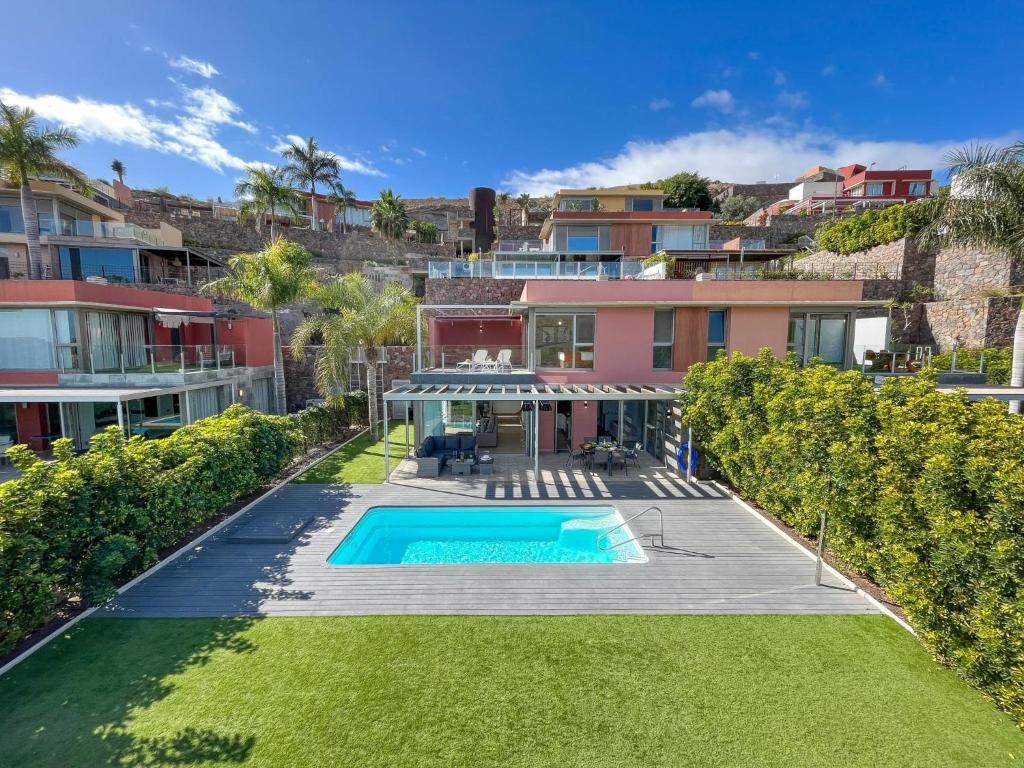 an aerial view of a house with a swimming pool at Los Dragos 13 Salobre by VillaGranCanaria in Maspalomas