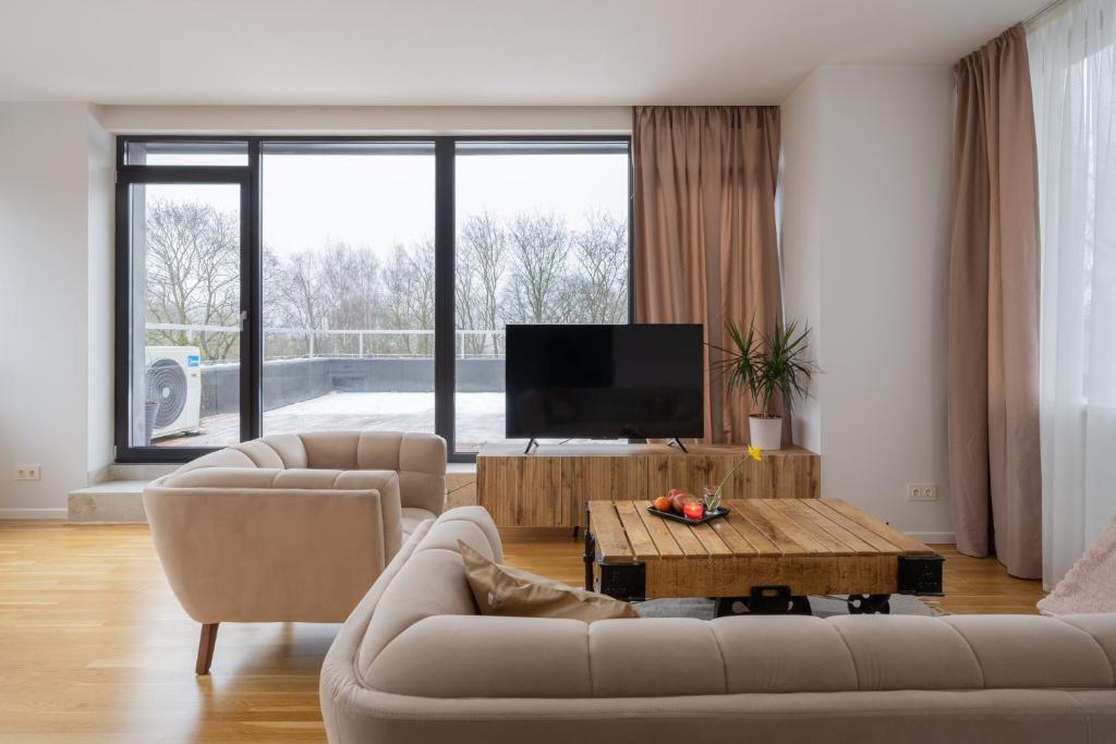 Et tv og/eller underholdning på 1-bedroom penthouse with underground parking