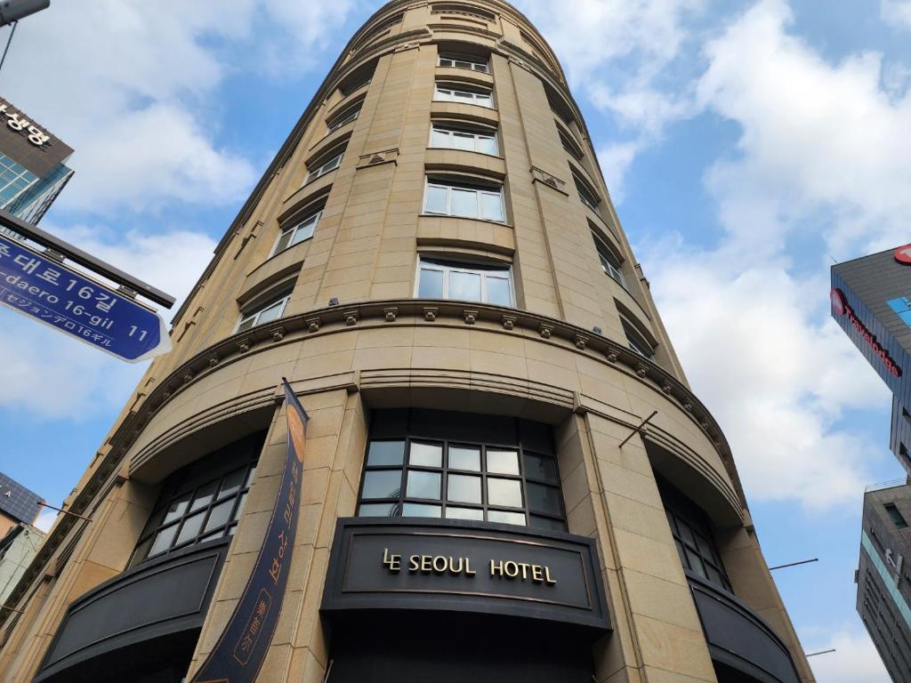 a tall building with the words le stew hotel at LE SEOUL HOTEL in Seoul