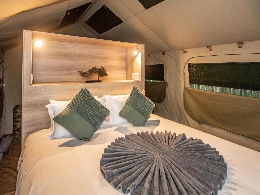 a bed in the back of a tent at Langa Langa Tented Safari Camp in Huntingdon