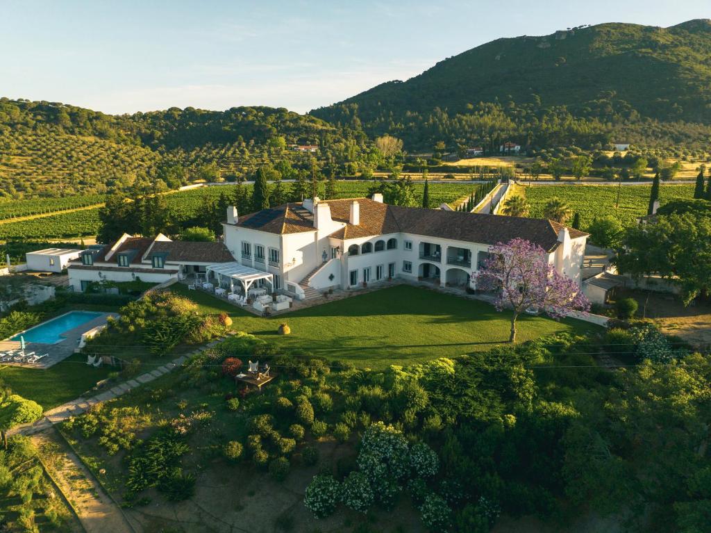 an aerial view of a large white house with a yard at Hotel Casa Palmela - Small Luxury Hotels of The World, Hotel & Villas in Setúbal