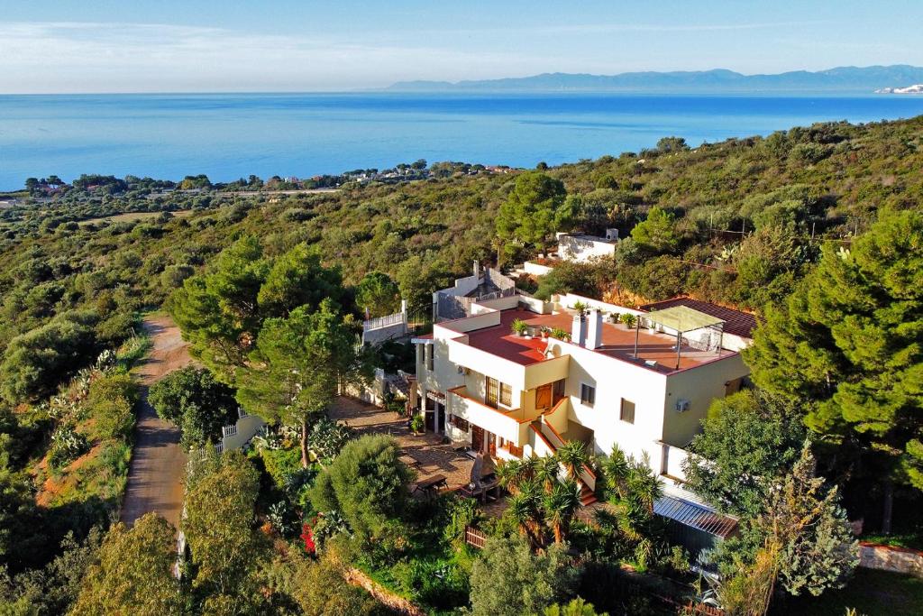 an aerial view of a house on a hill with the ocean at Villa Bella Salmagi in Capitana