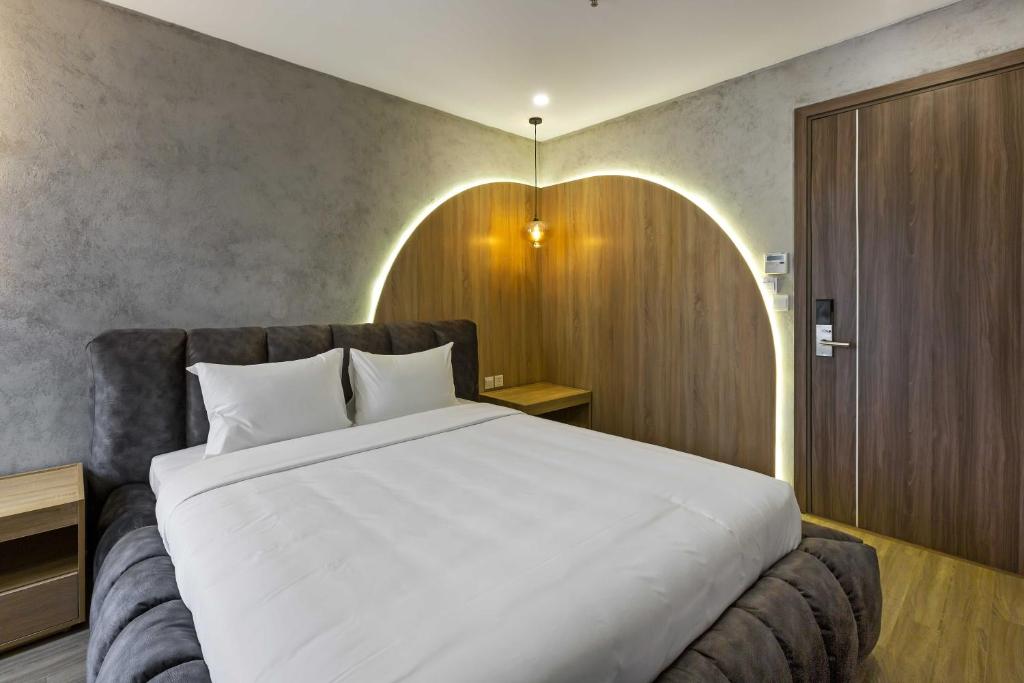 Postel nebo postele na pokoji v ubytování Jacayl Hotel TCG