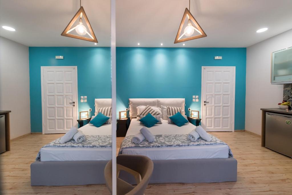 Posteľ alebo postele v izbe v ubytovaní LEFKAS CITY APARTMENTS & SUITES
