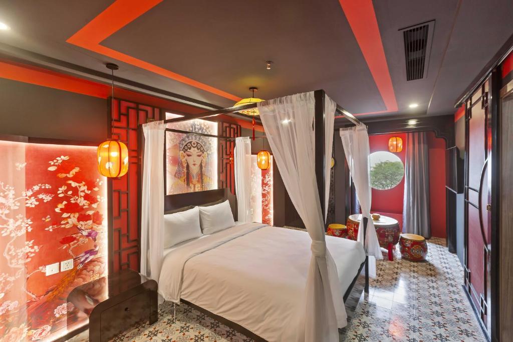 Postel nebo postele na pokoji v ubytování Jacayl Hotel TCG