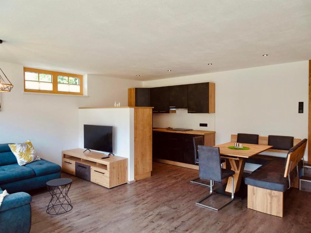 Televízia a/alebo spoločenská miestnosť v ubytovaní Apartment Silberwald