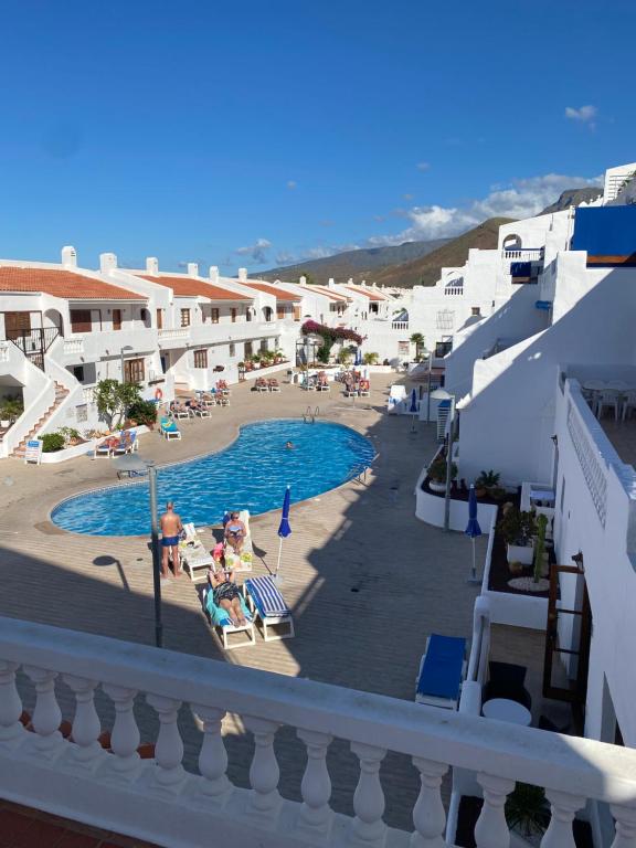 a view of a swimming pool in a resort at Los Cristianos port royal in Los Cristianos