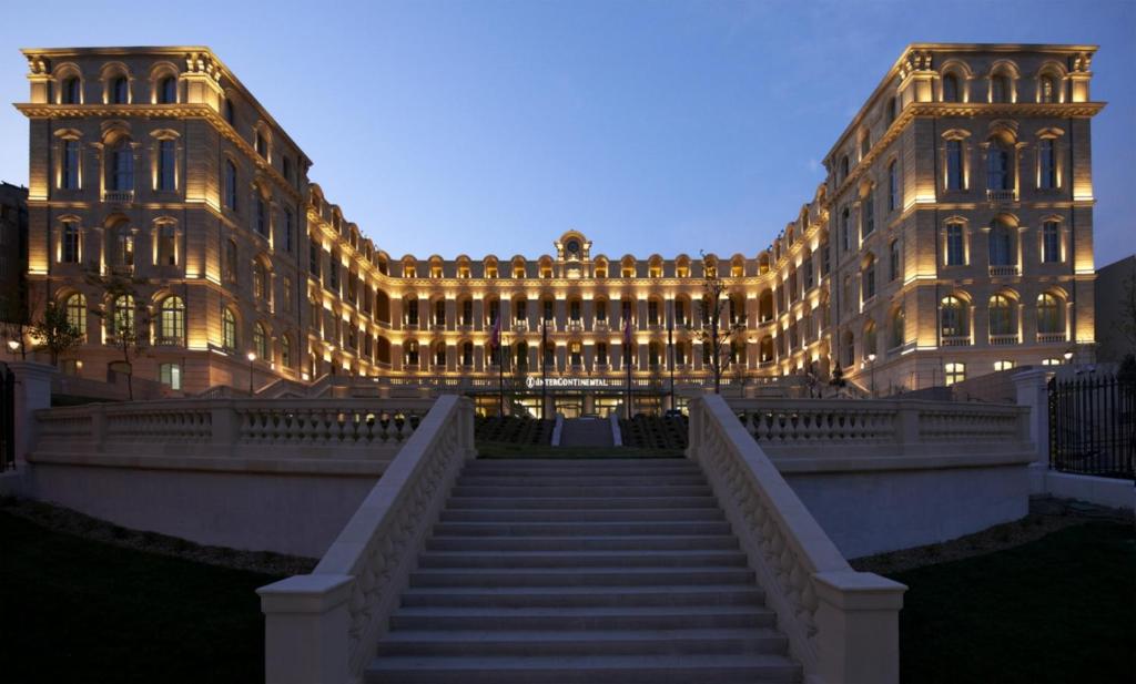 a large building with stairs in front of it at InterContinental Marseille - Hotel Dieu, an IHG Hotel in Marseille