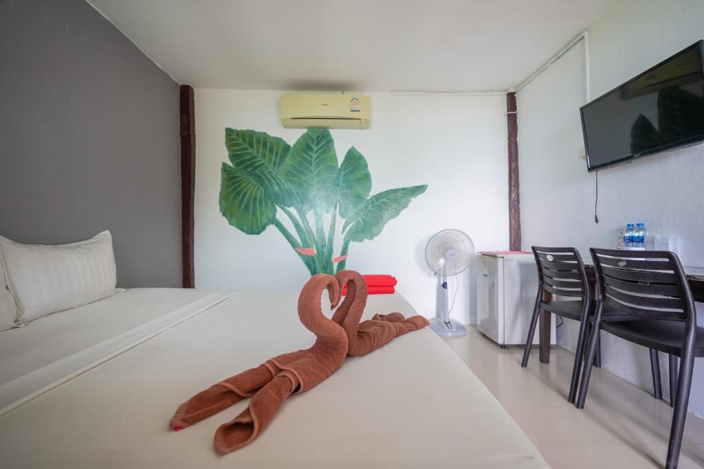 A television and/or entertainment centre at Phi Phi Cozy Seafront Resort