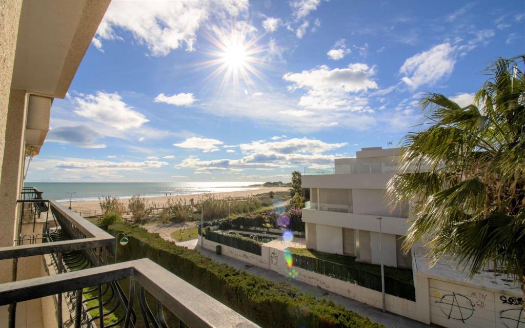 a view of the beach from a balcony of a condo at Primera línea con vistas al mar - Playamar 1022 ALBERT VILLAS in Alcossebre