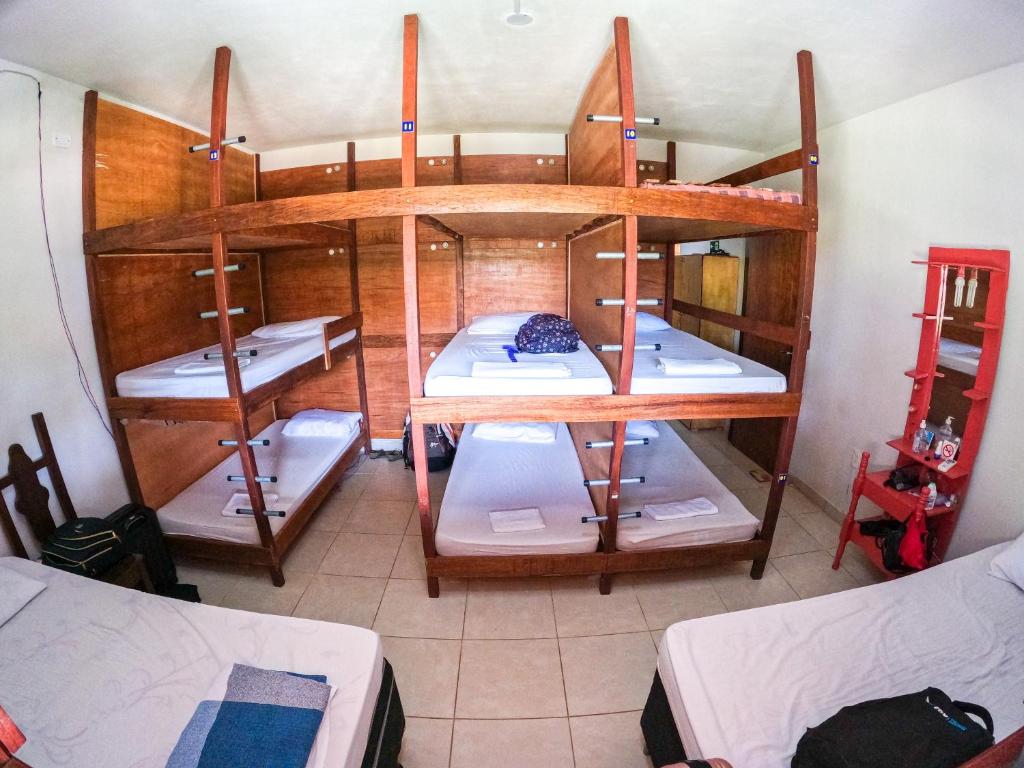 an overhead view of a room with three bunk beds at The Beach Hostel Milagres in São Miguel dos Milagres