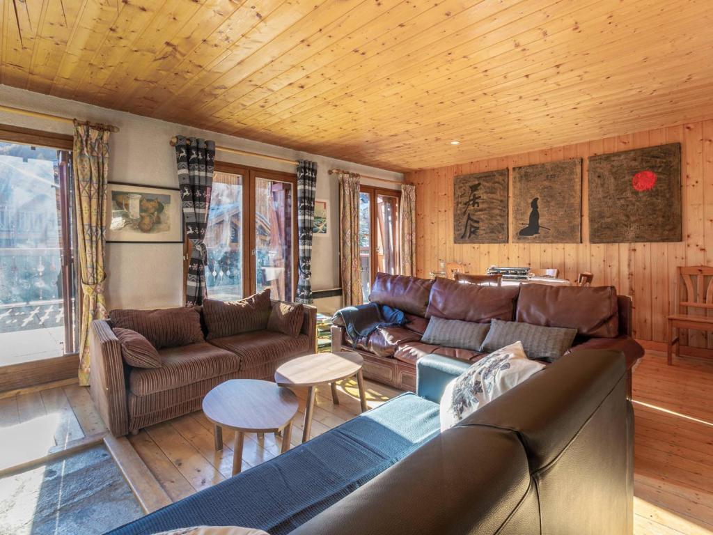 a living room with leather furniture and a wooden ceiling at Appartement Val-d'Isère, 4 pièces, 5 personnes - FR-1-519-33 in Val-d'Isère