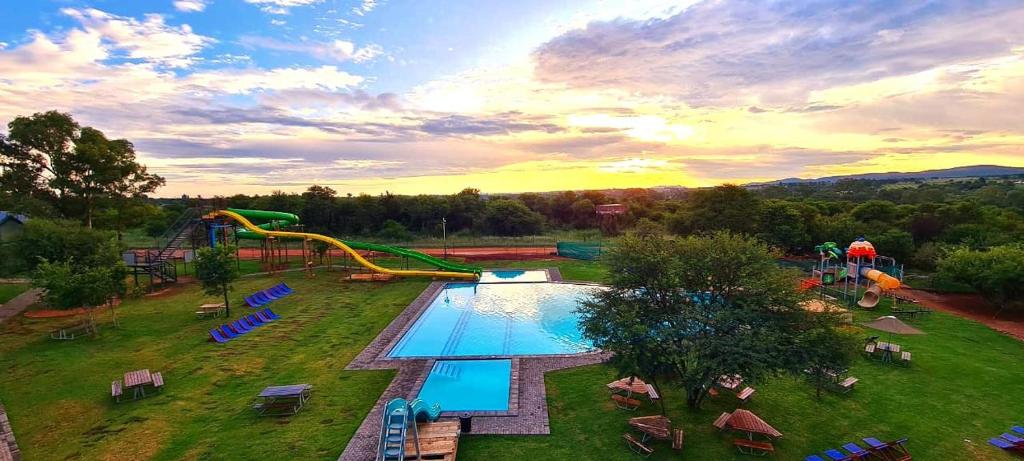 an aerial view of a water park with a slide at Casa Cara Resort in Parys