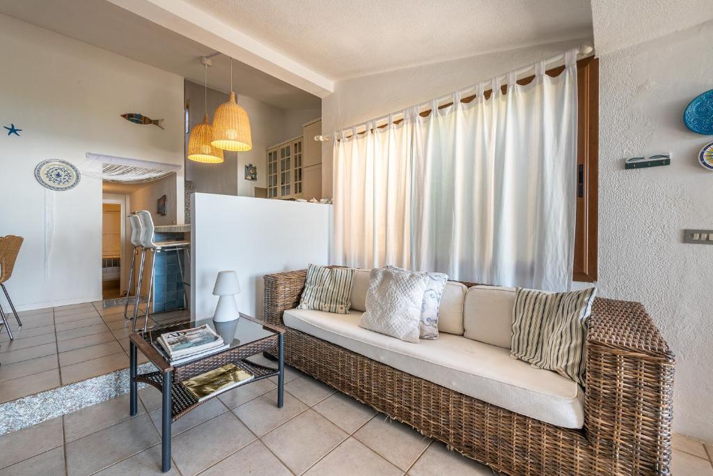 A seating area at Domus Luna Apartment with sea view Villasimius