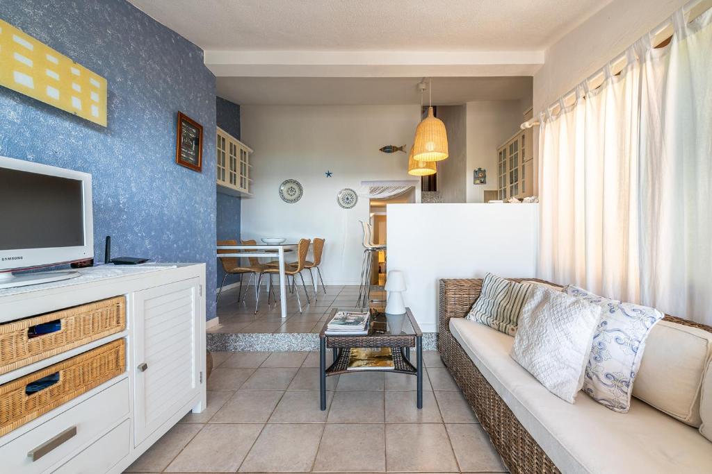 A kitchen or kitchenette at Domus Luna Apartment with sea view Villasimius