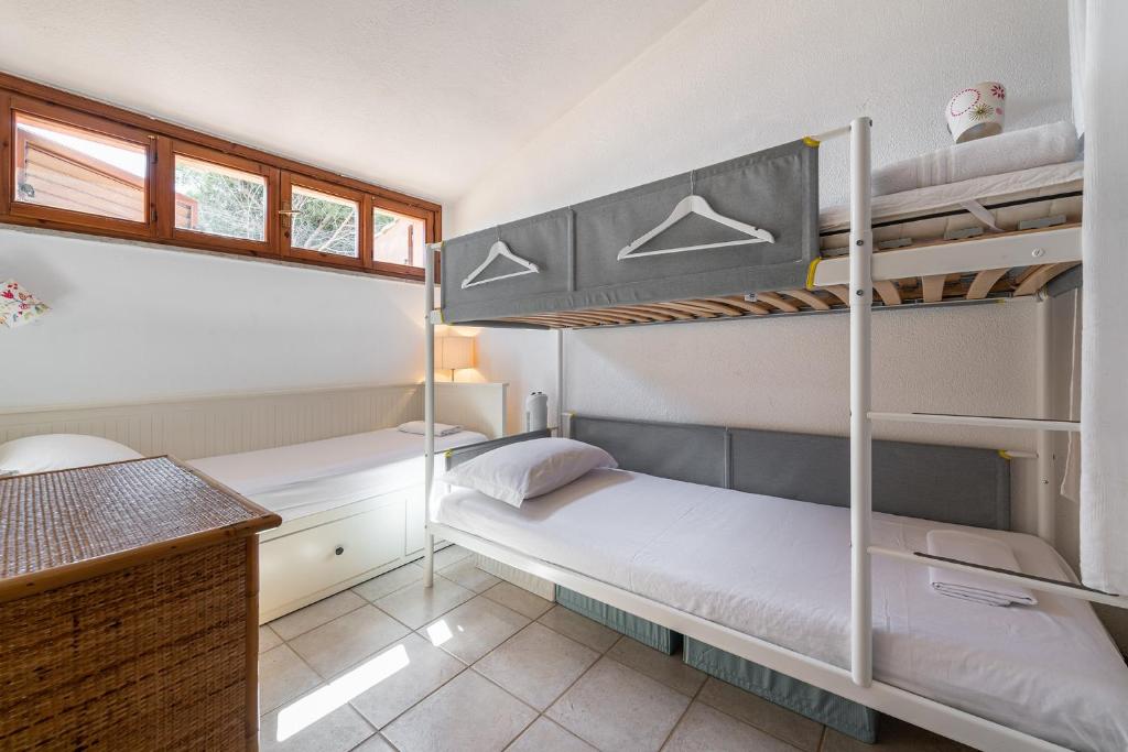 A bed or beds in a room at Domus Luna Apartment with sea view Villasimius