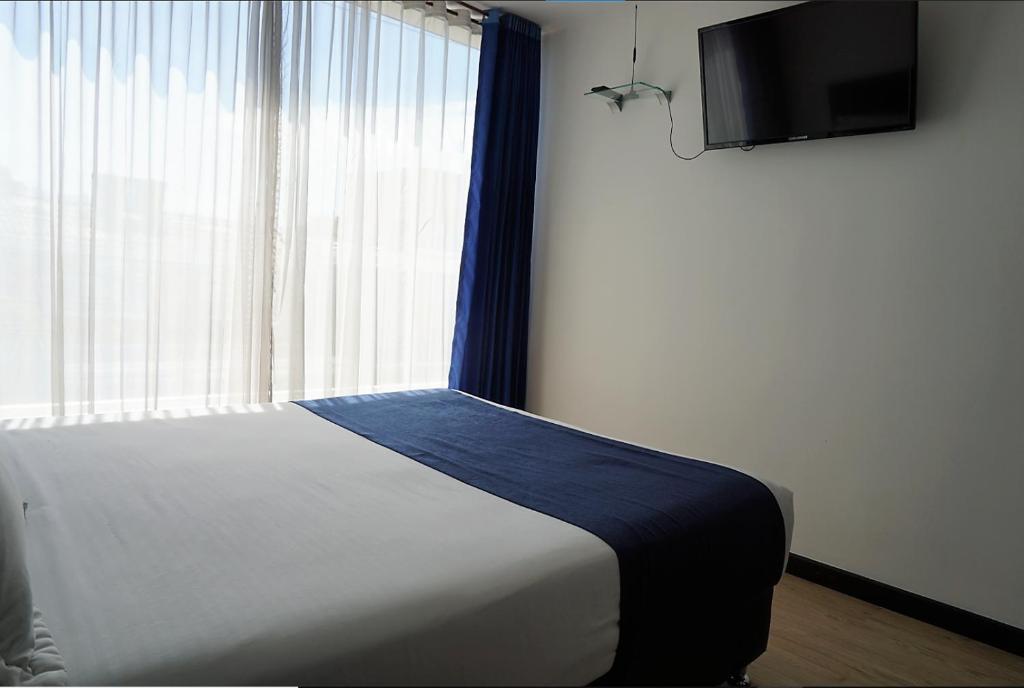 TV a/nebo společenská místnost v ubytování Hotel CGH Bogota Airport