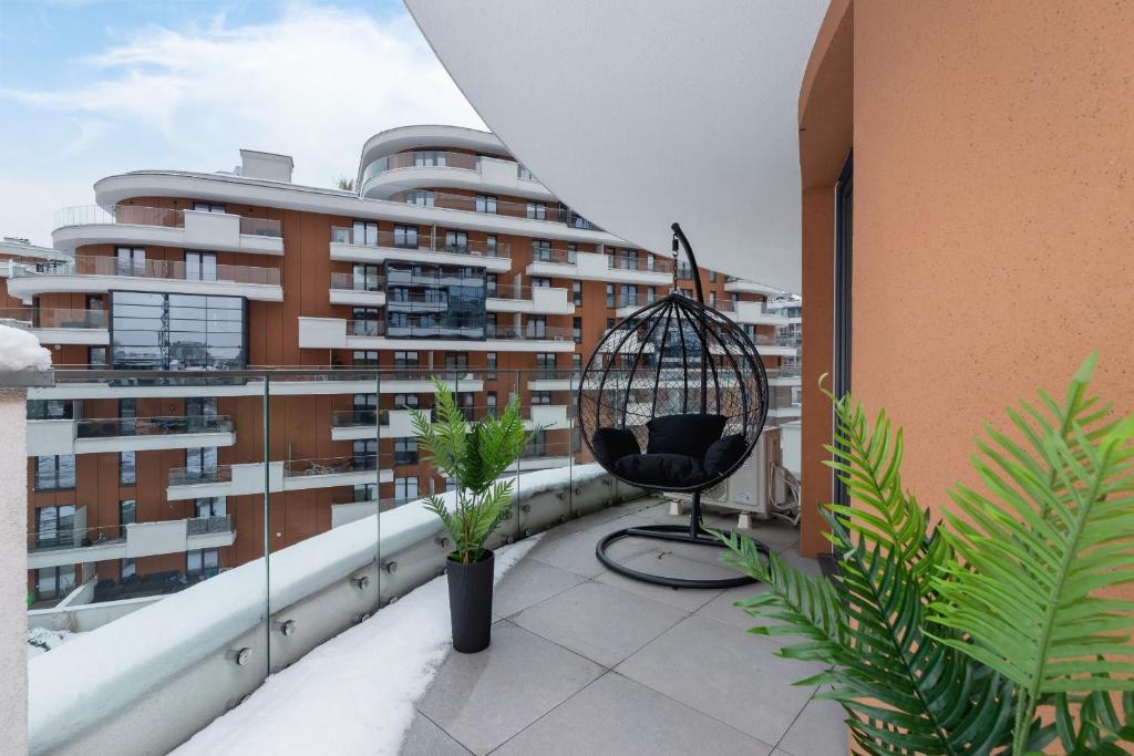 Balkón alebo terasa v ubytovaní Wiślane Tarasy Lux Apartments Cracow by Renters Prestige