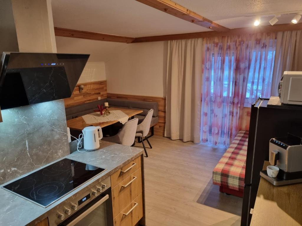Kuchyň nebo kuchyňský kout v ubytování Hotel Gletschermühle