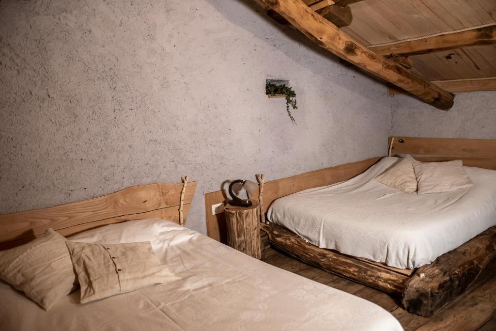 Postel nebo postele na pokoji v ubytování Agribenessere Agli Abatti