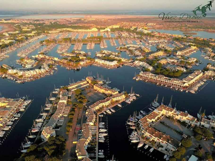 an aerial view of a harbor with boats at Hébergement insolite studio Grau du Roi Mas des Marines Piscine in Le Grau-du-Roi