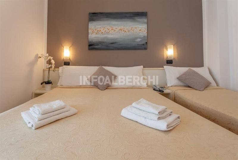 Postel nebo postele na pokoji v ubytování HOTEL CONTI