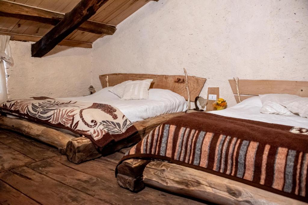 Postel nebo postele na pokoji v ubytování Agribenessere Agli Abatti