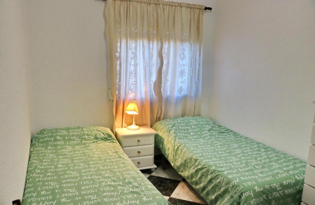 Posteľ alebo postele v izbe v ubytovaní Apartamento Plaza la Fuente